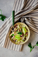 Apple celery root slaw in ceramic bowl. selective focus