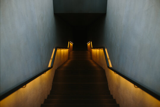 Ambient-lit staircase in a minimalist setting