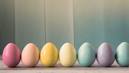 pastel easter eggs on a table with a teal wooden background - copy text space