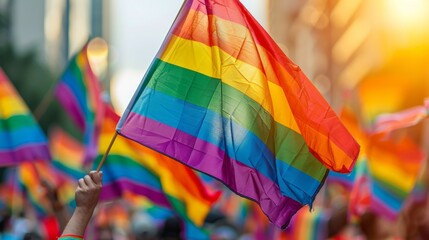 A colorful Pride parade with rainbow flags, symbolizing equality and acceptance for the LGBTQ+...