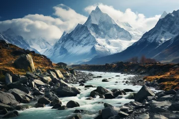 Foto op Canvas Water flows through snowy mountains in rocky valley under cloudy sky © JackDong
