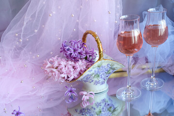 Still life with flowers and wine glasses