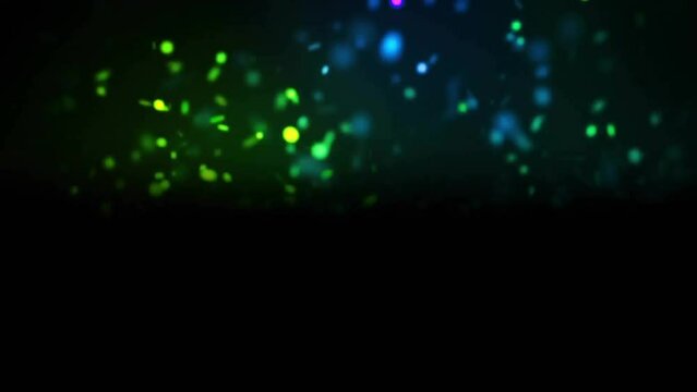 Animation of glowing light spots moving over black background