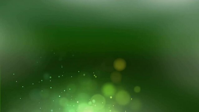 Animation of glowing light spots moving over green background
