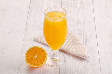 Sweet fresh orange juice in the glass