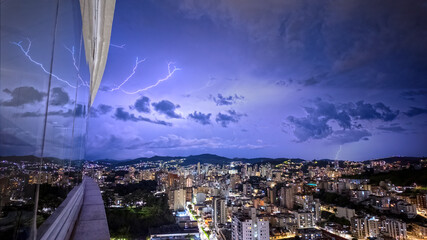 Dramatic Lightning Storm Over Cityscape at Night