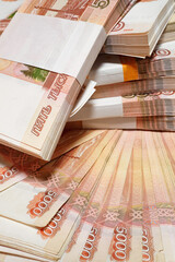 Vertical photo, Russian money, five thousand bills close-up, business concept. Selective focus blur.