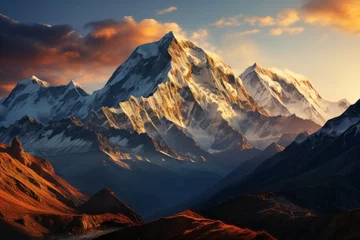 Photo sur Aluminium brossé Himalaya Snowcovered mountain at sunset with cloudy sky in the natural landscape