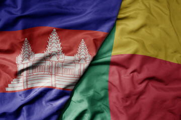 big waving national colorful flag of benin and national flag of cambodia.