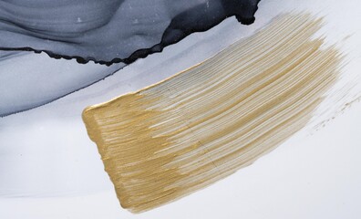 Hand drawn brush stroke gold paint stain texture on paper. High resolution photo taken from...