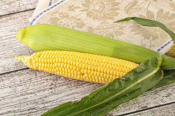 Yellow sweet raw cob corn