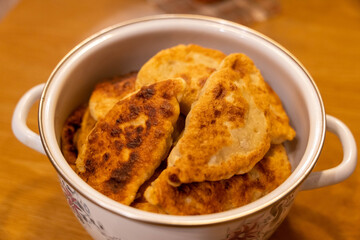 Freshly cooked homemade fried chebureks with meat are a delicious and traditional dish.