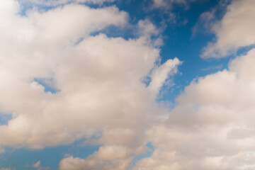Obraz premium View of white clouds in the blue sky in the afternoon. Daylight, afternoon, cloudy day. Abstract, cloudscape, peaceful, nature and freedom concept