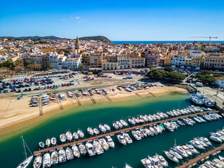 The golden sands of Palamos' beaches glisten under the sun when viewed from above, attracting tourists from across Europe.
