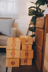 Asian SME business women use laptop computer checking customer order online shipping boxes at home. Starting Small business entrepreneur SME freelance. Online business, Work at home concept.