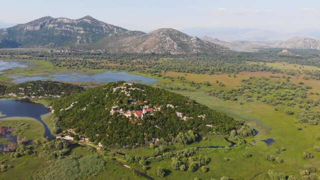 Monastery Kom in Skadar lake. Serbian Orthodox monastery in Montenegro. Religious and tourist attraction of Montenegro.
