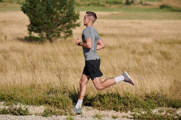 Determined Stride: Athletic Man Embarks on Marathon Preparation with Resolve.