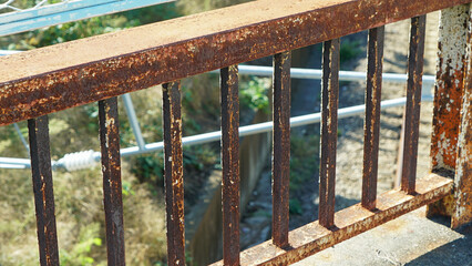 Outdoor metal railing with rust and peeling paint