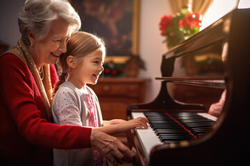 Elderly grandmother teaches her granddaughter to play music on a piano and having fun