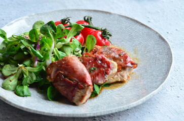 Saltimbocca. Veal schnitzel with sage and Parma ham. Italian specialty. close up view, yummy