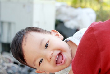 Portrait of a cute boy Cute 2 year old Asian looks cheekily and Teasing with smiling and looking at camera