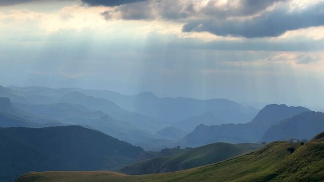 Gumbashi Pass, the highest mountain pass in Russia. View of the green mountains and hills at sunset. Beautiful summer landscape in the North Caucasus. Beautiful epic view of the valley.Evening