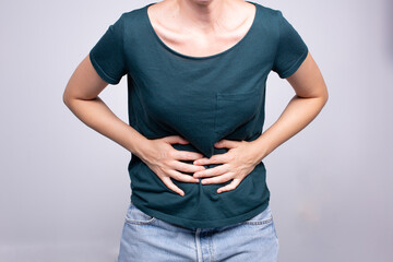 woman experiencing abdominal pain, health issues concept