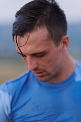 Fototapeta premium Post-Run Repose: Sweaty Athlete Rests After Intense Daily Run.