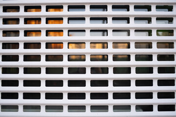 Metal grid. White metal blinds on the window. Protection against theft.