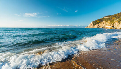Sea waves at the beach. Deep blue ocean water. Sunny natural landscape.