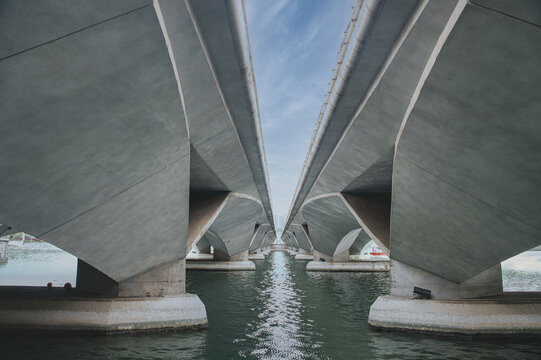 Symmetrical perspective under concrete bridge arches