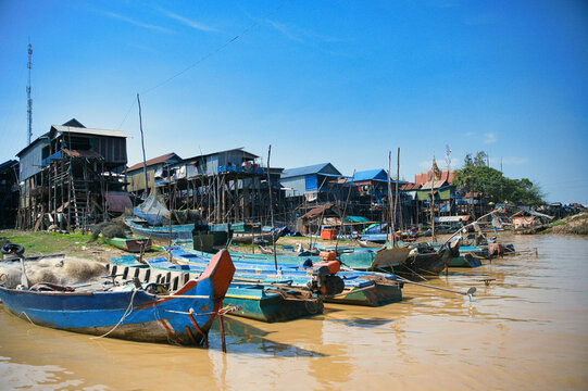 Floating village with stilt houses and traditional boats