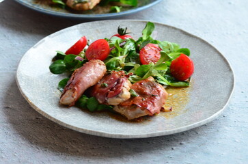 Saltimbocca. Veal schnitzel with sage and Parma ham. Italian specialty. close up view, yummy