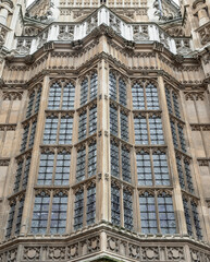 Fototapeta na wymiar Detail Design in Architecture is Victorian Gothic Palace of Westminster, Entrance to the Houses of Parliament in Westminster. Space for text, Selective focus.