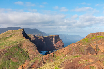 Panoramic view of majestic Atlantic Ocean coastline at Ponta de Sao Lourenco peninsula, Canical, Madeira island, Portugal, Europe. Coastal hiking trail along steep rocky rugged cliffs. Sea breeze. Awe