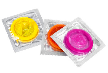 Top view of colored condoms in packing isolated on a white background. Condom in seal package. - 757518584