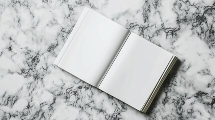 Blank notebook with empty pages. Isolated on white marble background. Top view.