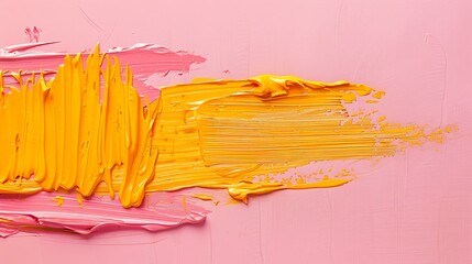 Yellow and pink oil paint smeared on a pink background. The paint is thick and has a glossy finish....