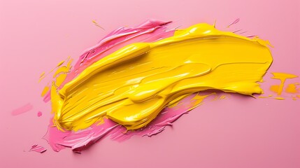 Yellow and pink oil paint on a pink background. The paint is in various shades and has a glossy...