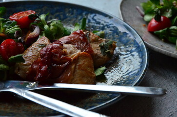 Saltimbocca. Veal schnitzel with sage and Parma ham. Italian specialty. close up view, yummy