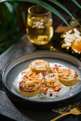 Delicious pancakes with yogurt, berry jam and fruit on plate on marble table with drinks. Healthy breakfast food, diet, top view