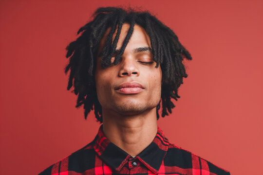 Serene young afro man with closed eyes and dreadlocks. Generative AI image