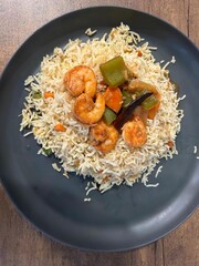 Chilly Garlic Prawn with fried rice which is a chinese cuisine or dish