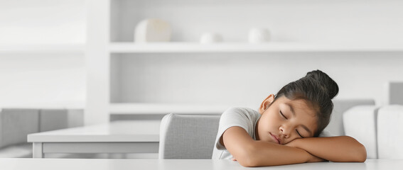 Young Girl Resting on Arms at a Clean Modern Table Setting. Tired after school. Banner with copy space