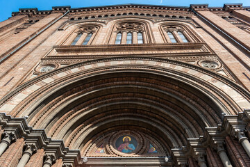 Archivolts at the entrance portal with image of Jesus in the Sacro Cuore di Gesù church, Bologna ITALY