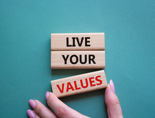 Live your values symbol. Concept words Live your values on wooden blocks. Beautiful grey green...