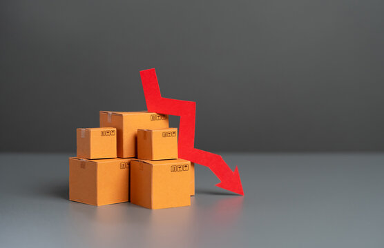 Boxes with goods and down arrow. Falling prices. Reduction in supplies and production rates. Deterioration in the attractiveness of goods, low demand. Economic GDP slowdown. Tax reduction.