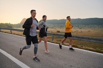 Running towards a common goal, a group of colleagues braves the misty morning air, their...