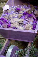 Small violet bags with aromatic seeds of lavender plant on market in Provence