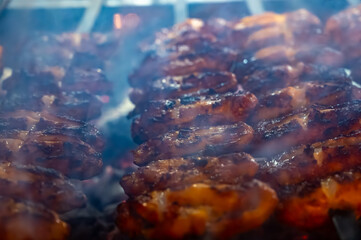 Turkish mixed grill meat, chicken wings, lamb, beef shashlik, kebab cooking on charcoal grill in restaurant